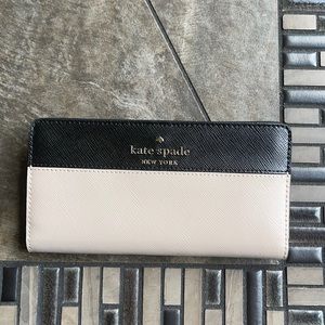 Kate Spade Staci Colorblock Large Slim Bifold Wallet:
saffiano